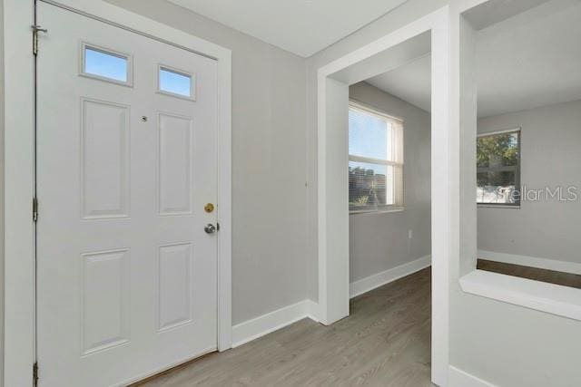 243 45th St N, Saint Petersburg, FL 33713 - foyer featuring wood finished floors and baseboards