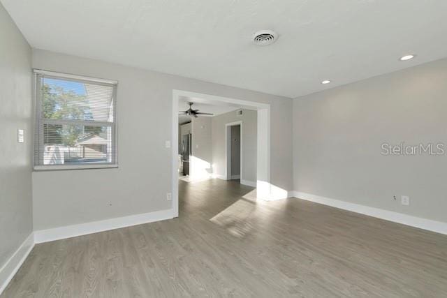 243 45th St N, Saint Petersburg, FL 33713 - unfurnished room featuring baseboards, wood finished floors, ceiling fan, and recessed lighting