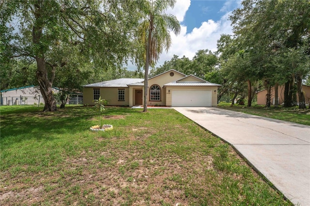 4032 Albany Rd, Labelle, FL 33935 - ranch-style home with a garage, stucco siding, concrete driveway, metal roof, and a front yard