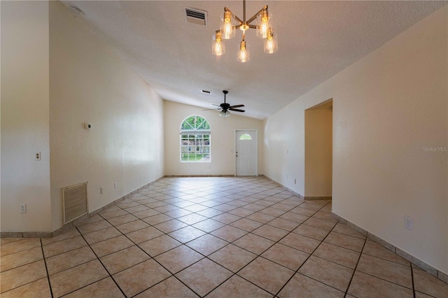 4032 Albany Rd, Labelle, FL 33935 - unfurnished room with light tile patterned floors, a chandelier, vaulted ceiling, and ceiling fan