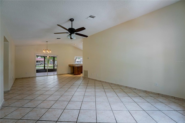 4032 Albany Rd, Labelle, FL 33935 - empty room with lofted ceiling, a ceiling fan, a chandelier, light tile patterned flooring, and a textured ceiling