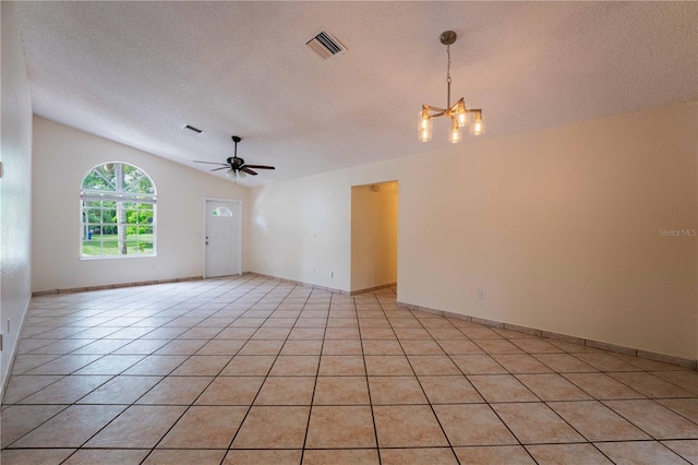 4032 Albany Rd, Labelle, FL 33935 - spare room with a chandelier, vaulted ceiling, ceiling fan, a textured ceiling, and light tile patterned flooring