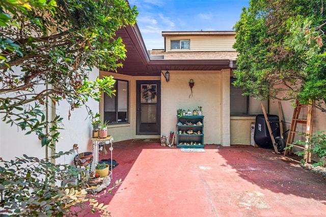 940 Fenton Ln Unit 7, Lakeland, FL 33809 - doorway to property featuring a patio and stucco siding