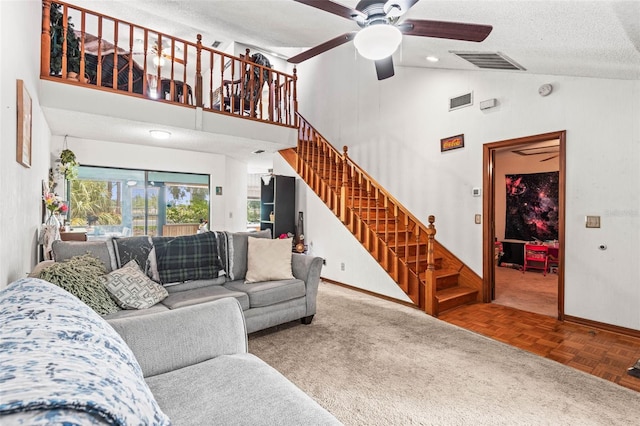 940 Fenton Ln Unit 7, Lakeland, FL 33809 - living area with ceiling fan, baseboards, stairway, high vaulted ceiling, and a textured ceiling