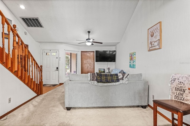 940 Fenton Ln Unit 7, Lakeland, FL 33809 - living area with stairs, carpet floors, a ceiling fan, and baseboards
