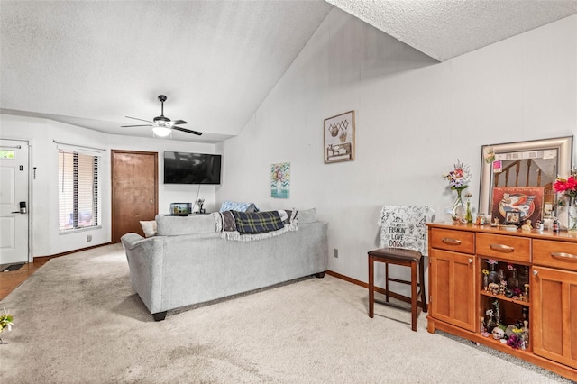 940 Fenton Ln Unit 7, Lakeland, FL 33809 - living area with a textured ceiling, lofted ceiling, a ceiling fan, light colored carpet, and baseboards