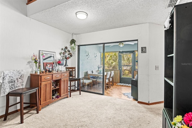 940 Fenton Ln Unit 7, Lakeland, FL 33809 - living area with carpet, a textured ceiling, a ceiling fan, and baseboards