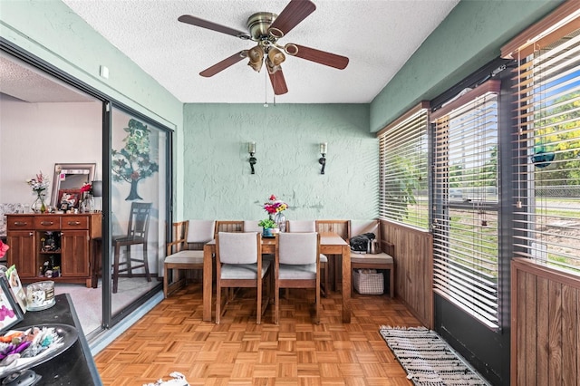 940 Fenton Ln Unit 7, Lakeland, FL 33809 - dining room featuring a textured ceiling, a ceiling fan, and a textured wall