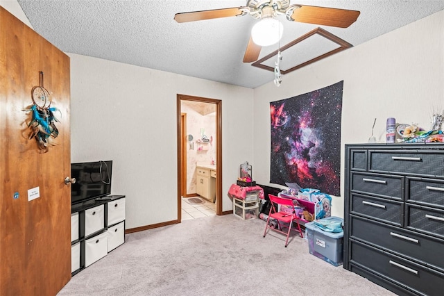 940 Fenton Ln Unit 7, Lakeland, FL 33809 - bedroom with carpet, ensuite bath, a textured ceiling, and ceiling fan