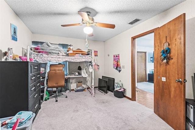 940 Fenton Ln Unit 7, Lakeland, FL 33809 - carpeted bedroom featuring an office area, a ceiling fan, baseboards, and a textured ceiling