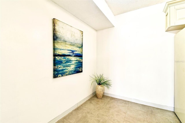 1109 Pine Ridge Cir W Unit C1, Tarpon Springs, FL 34688 - empty room featuring baseboards and light tile patterned floors