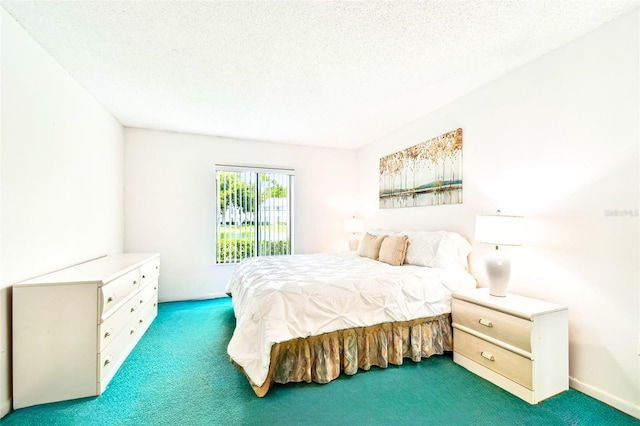 1109 Pine Ridge Cir W Unit C1, Tarpon Springs, FL 34688 - bedroom with carpet floors and a textured ceiling