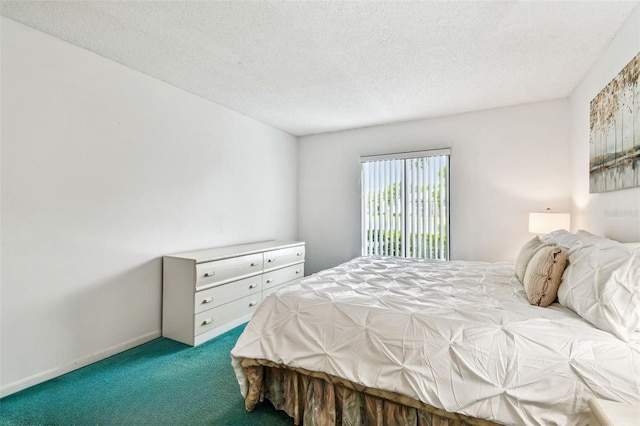 1109 Pine Ridge Cir W Unit C1, Tarpon Springs, FL 34688 - bedroom featuring carpet floors and a textured ceiling