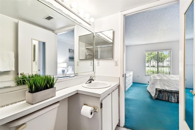 1109 Pine Ridge Cir W Unit C1, Tarpon Springs, FL 34688 - ensuite bathroom with vanity