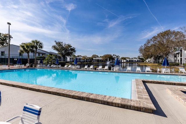 1109 Pine Ridge Cir W Unit C1, Tarpon Springs, FL 34688 - community pool featuring a residential view