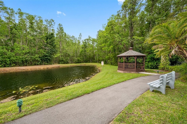 1109 Pine Ridge Cir W Unit C1, Tarpon Springs, FL 34688 - view of home's community featuring a gazebo, a lawn, a water view, and a forest view