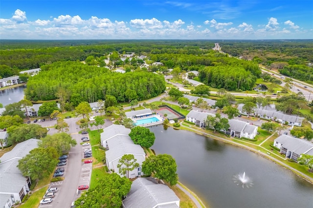 1109 Pine Ridge Cir W Unit C1, Tarpon Springs, FL 34688 - aerial view of residential area with a forest, a nearby body of water, and a pool area