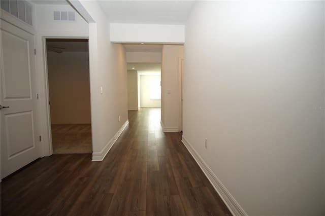 9512 Summers Cay Cir, Thonotosassa, FL 33592 - corridor featuring dark wood-type flooring and baseboards
