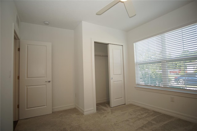 9512 Summers Cay Cir, Thonotosassa, FL 33592 - unfurnished bedroom featuring carpet floors, a closet, a ceiling fan, and baseboards