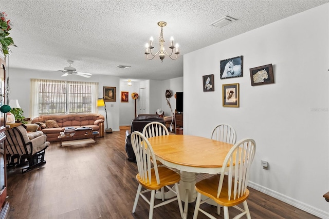 1633 Bentwood Dr, Sun City Center, FL 33573 - dining room with a chandelier, a textured ceiling, dark wood-style floors, and baseboards