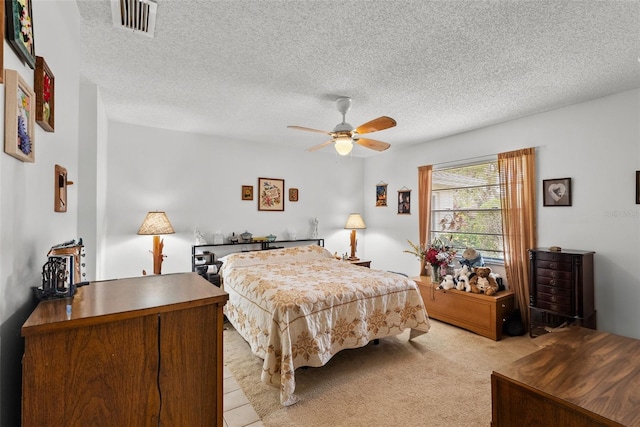 1633 Bentwood Dr, Sun City Center, FL 33573 - bedroom featuring a textured ceiling, light carpet, and ceiling fan