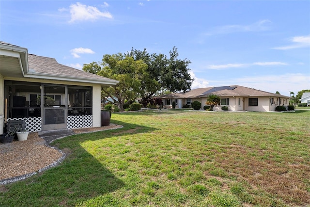 1633 Bentwood Dr, Sun City Center, FL 33573 - view of green lawn with a sunroom