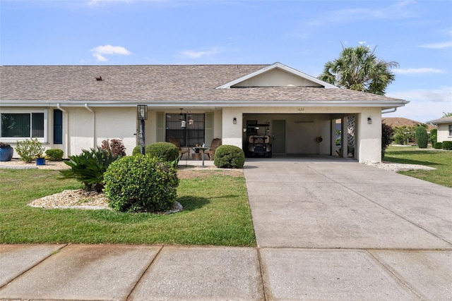 1633 Bentwood Dr, Sun City Center, FL 33573 - ranch-style home featuring concrete driveway, a front lawn, stucco siding, an attached carport, and roof with shingles