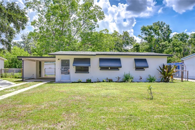6004 S 82nd St, Tampa, FL 33619 - view of front of property with stucco siding and an attached carport