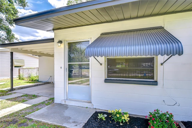 6004 S 82nd St, Tampa, FL 33619 - view of exterior entry featuring concrete block siding