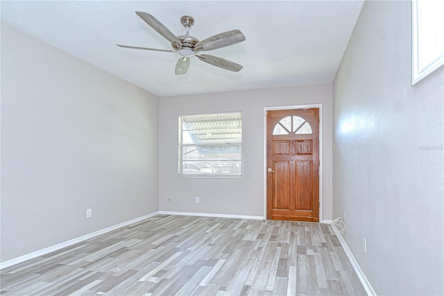 6004 S 82nd St, Tampa, FL 33619 - foyer featuring light wood finished floors, a ceiling fan, and baseboards