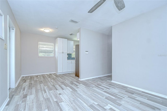6004 S 82nd St, Tampa, FL 33619 - spare room with light wood-type flooring, baseboards, and a ceiling fan