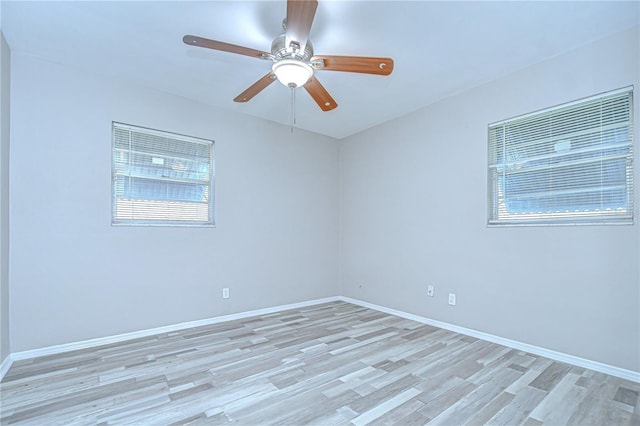 6004 S 82nd St, Tampa, FL 33619 - spare room with light wood-style floors, baseboards, and a ceiling fan