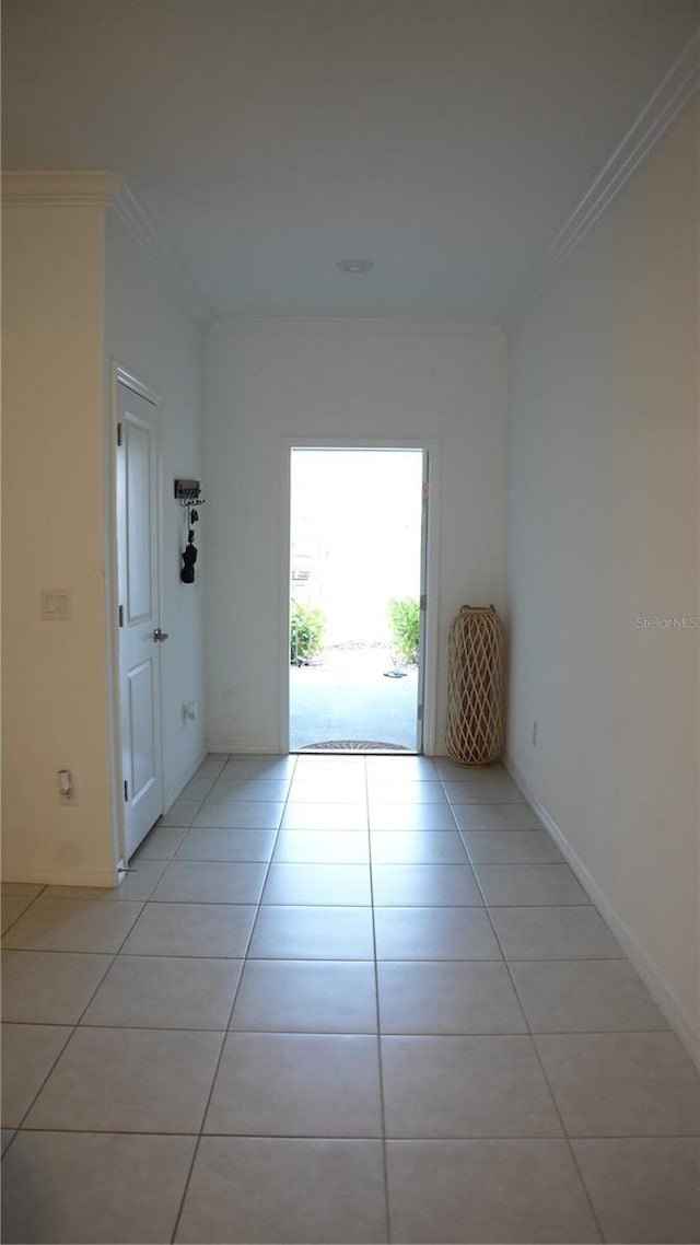 36439 Garden Wall Way, Zephyrhills, FL 33541 - spare room with light tile patterned flooring, crown molding, and baseboards