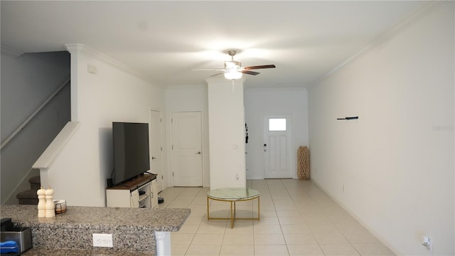 36439 Garden Wall Way, Zephyrhills, FL 33541 - living room with crown molding, light tile patterned floors, ceiling fan, and stairs