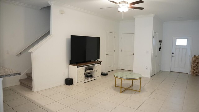 36439 Garden Wall Way, Zephyrhills, FL 33541 - living area with stairs, a ceiling fan, crown molding, baseboards, and light tile patterned floors