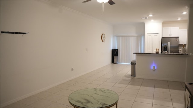 36439 Garden Wall Way, Zephyrhills, FL 33541 - kitchen featuring stainless steel fridge with ice dispenser, crown molding, ceiling fan, light tile patterned floors, and white cabinets