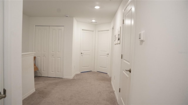36439 Garden Wall Way, Zephyrhills, FL 33541 - hall with light colored carpet, baseboards, and recessed lighting