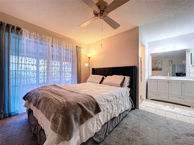 2031 Dover Ct, Oldsmar, FL 34677 - bedroom with a textured ceiling, light tile patterned floors, light carpet, vaulted ceiling, and ceiling fan