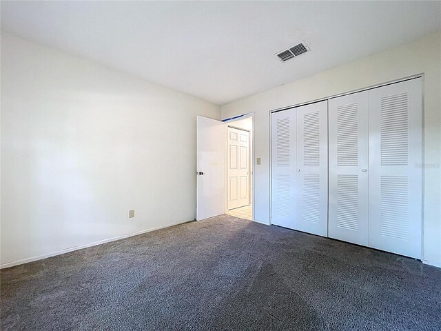 2031 Dover Ct, Oldsmar, FL 34677 - unfurnished bedroom with carpet floors and a closet