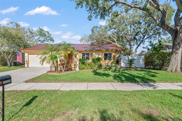 11125 117th St, Seminole, FL 33778 - ranch-style home with a standing seam roof, a garage, driveway, metal roof, and stucco siding