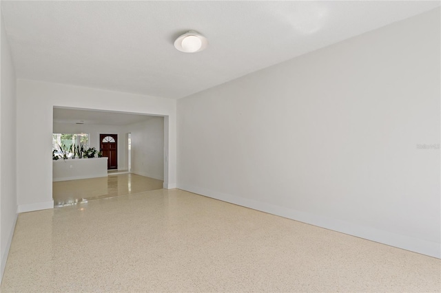 433 Pineapple St, Tarpon Springs, FL 34689 - unfurnished room featuring speckle patterned floor and baseboards