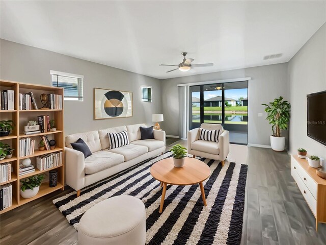 19664 Ship Wheel Way, Land O Lakes, FL 34638 - living area with plenty of natural light, wood finished floors, and a ceiling fan