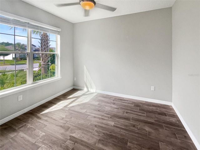 19664 Ship Wheel Way, Land O Lakes, FL 34638 - spare room featuring a ceiling fan, dark wood finished floors, and baseboards