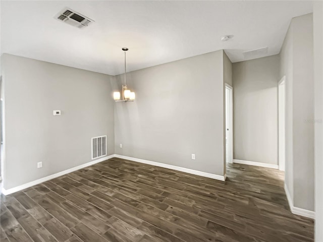 19664 Ship Wheel Way, Land O Lakes, FL 34638 - spare room featuring dark wood-style floors, a chandelier, and baseboards