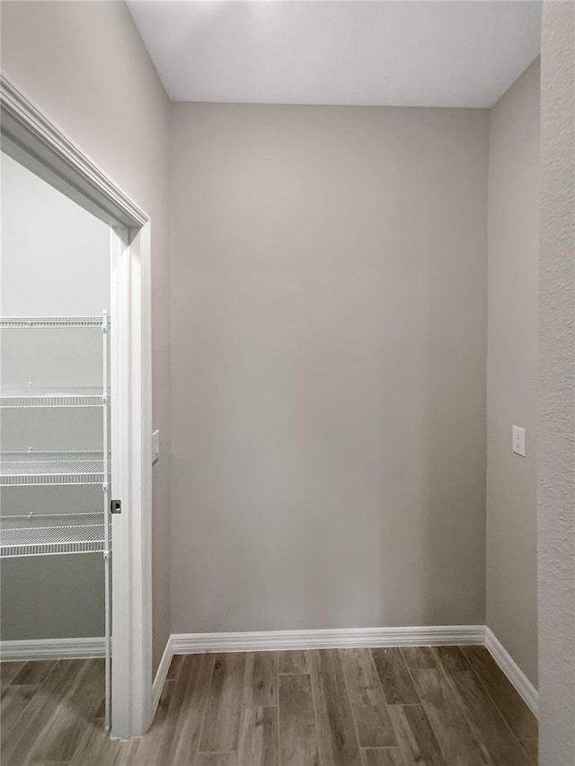 19664 Ship Wheel Way, Land O Lakes, FL 34638 - unfurnished room featuring wood finished floors and baseboards