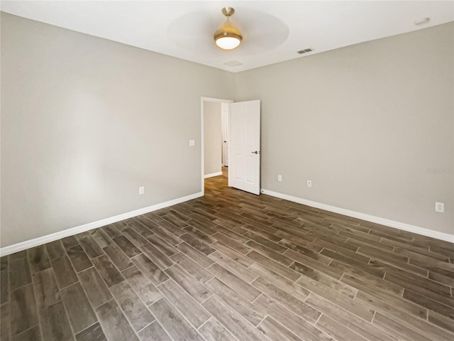 19664 Ship Wheel Way, Land O Lakes, FL 34638 - unfurnished room with dark wood-type flooring, baseboards, and a ceiling fan