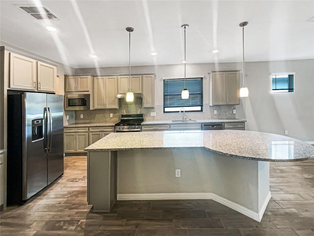 19664 Ship Wheel Way, Land O Lakes, FL 34638 - kitchen with appliances with stainless steel finishes, a sink, dark wood-style flooring, a center island, and recessed lighting