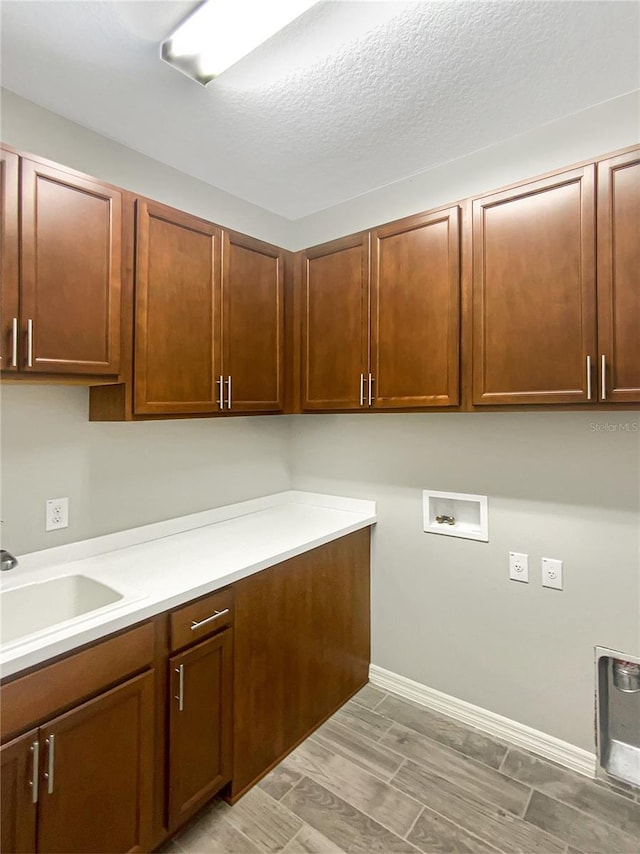 19664 Ship Wheel Way, Land O Lakes, FL 34638 - laundry room featuring cabinet space and washer hookup