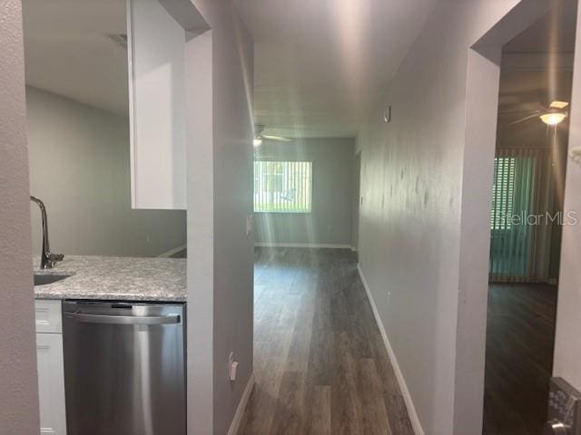 6520 Thicket Trl, New Port Richey, FL 34653 - corridor featuring dark wood finished floors, a sink, and baseboards