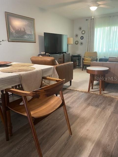 6520 Thicket Trl, New Port Richey, FL 34653 - living area with light wood finished floors and a ceiling fan